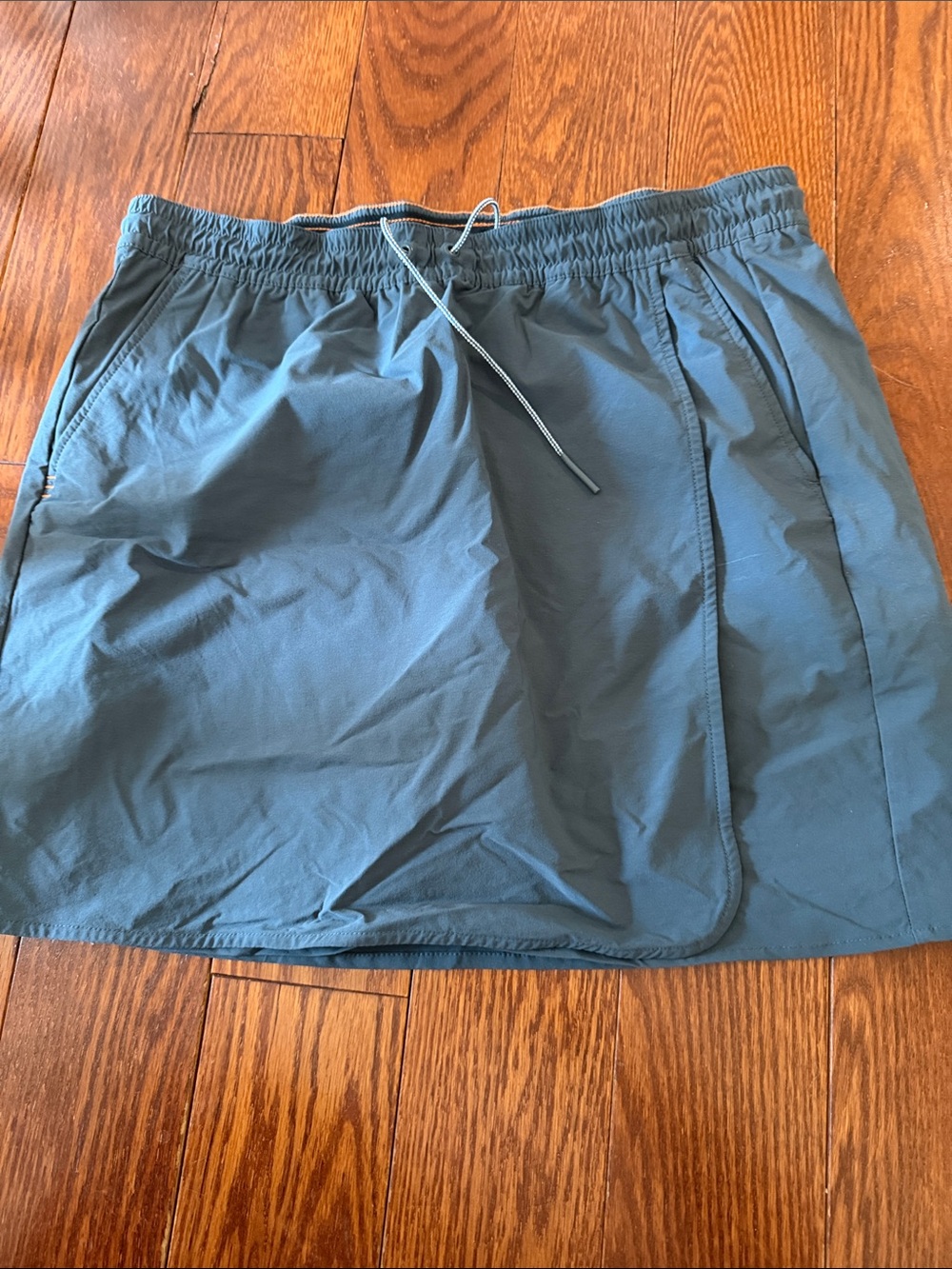 Orvis black athletic skort with orange trim